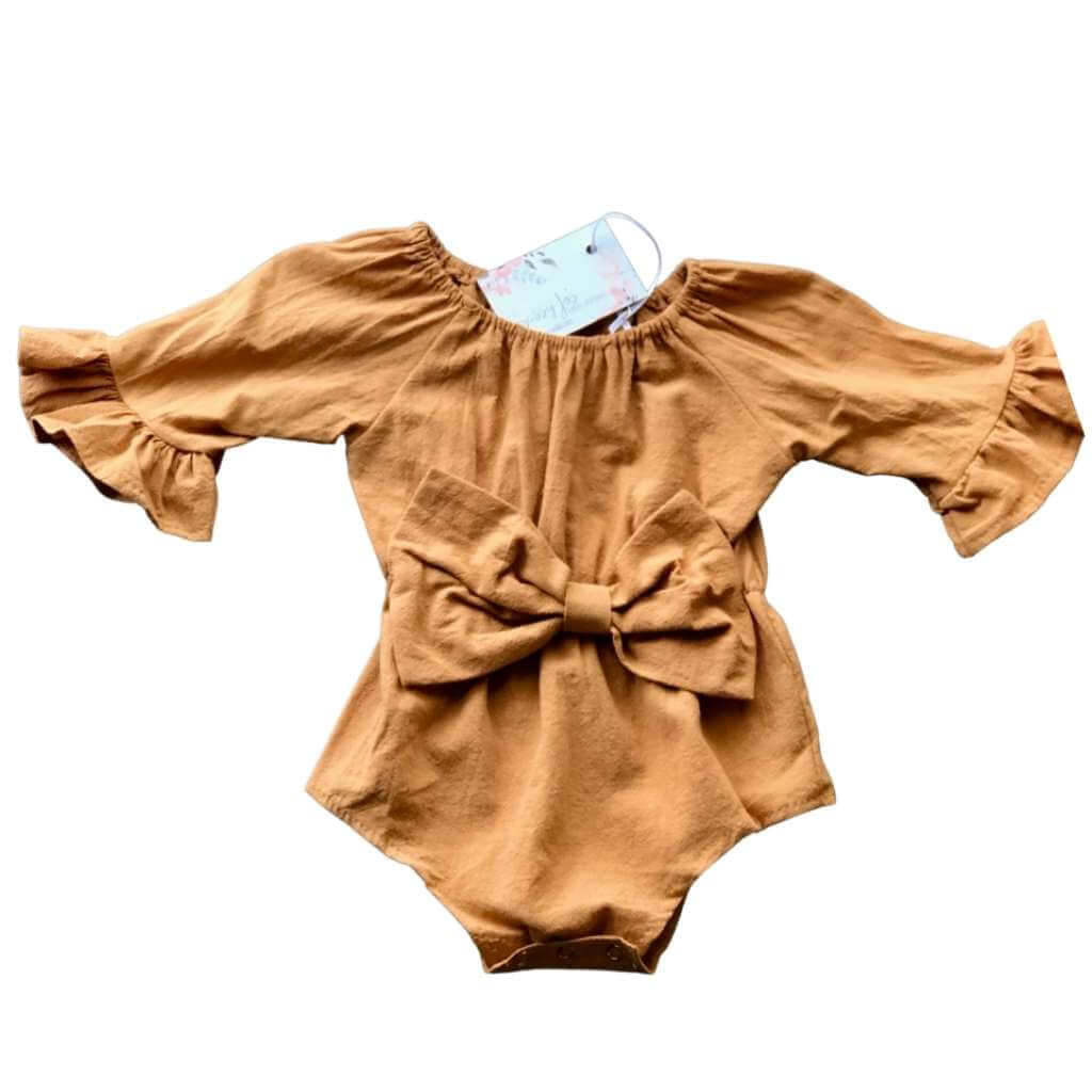 baby girl tan  bell-sleeved linen romper with box detail in the front.