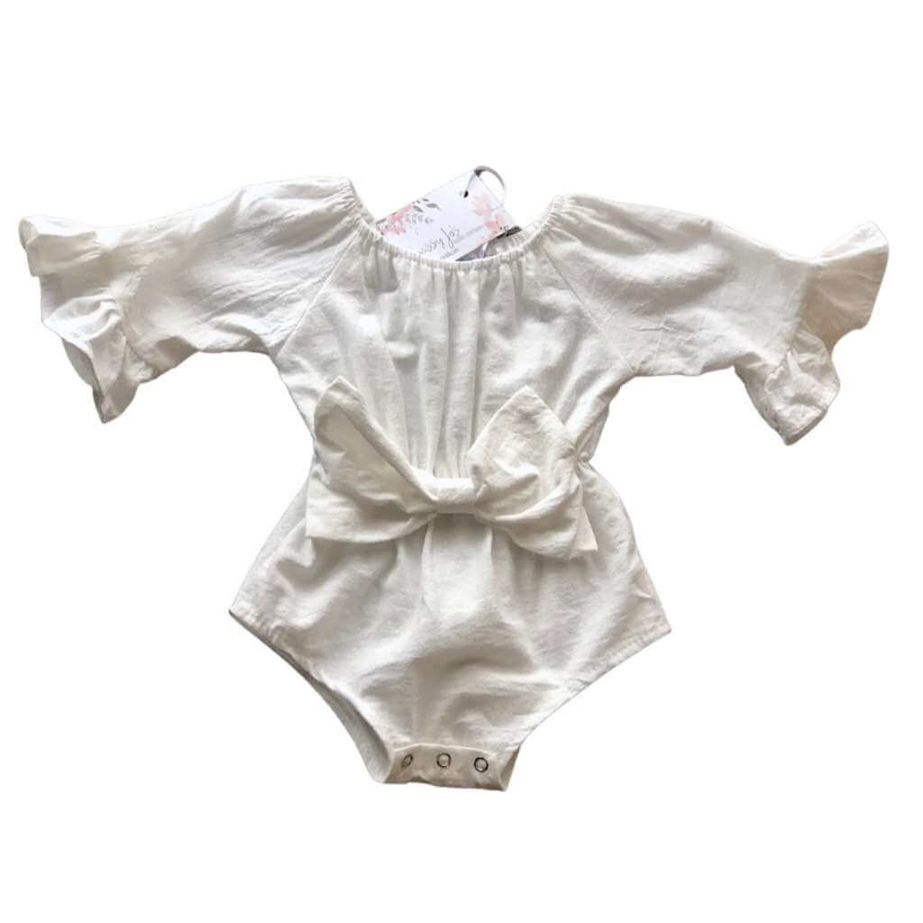 Baby girl white bell-sleeved linen romper with box detail in the front.